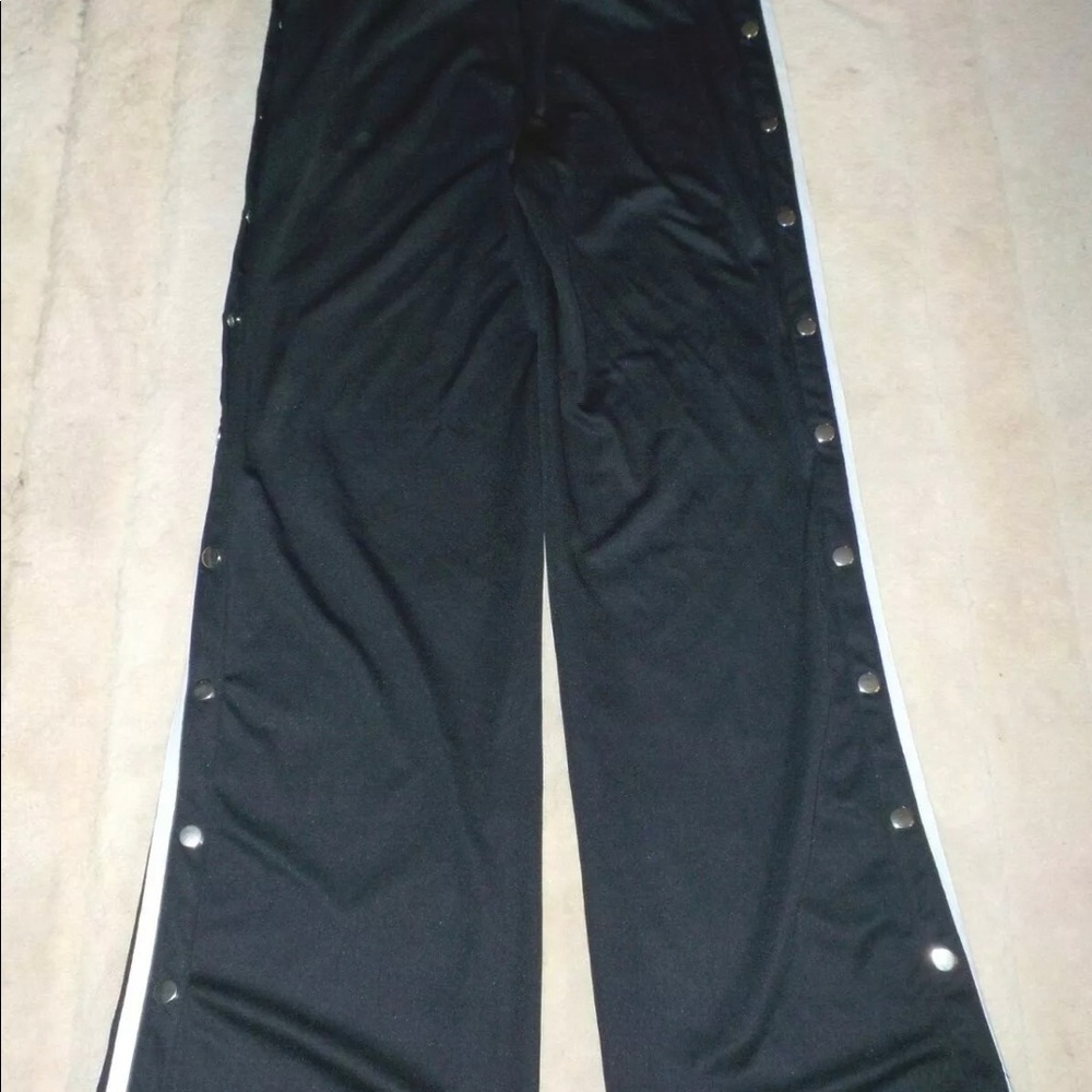Fashion nova warm up pants with snap sides, 2 snaps are missing